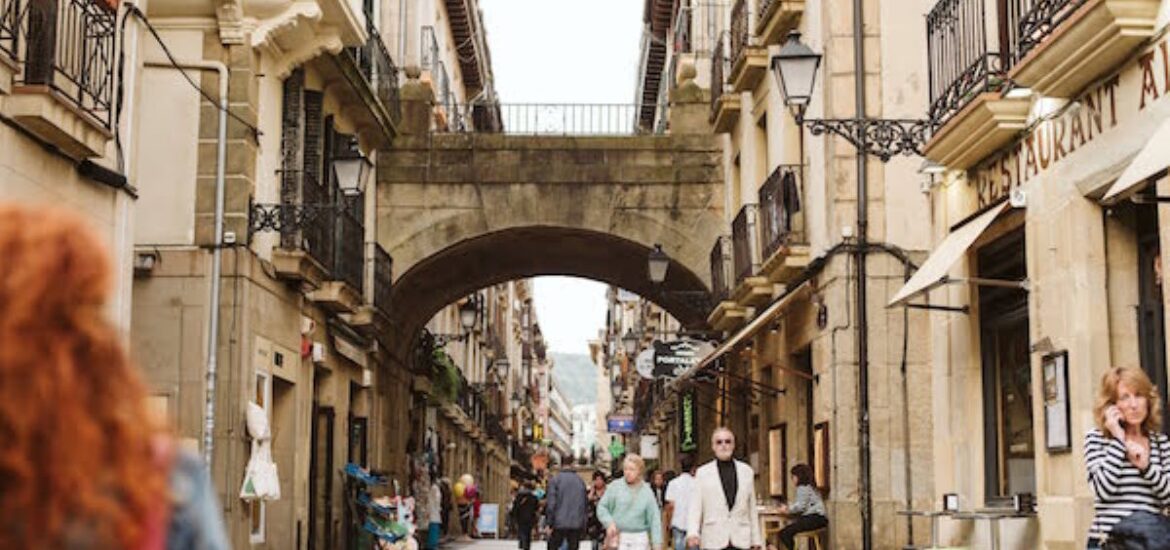 People walking around Old Town in San Sebastian in November.