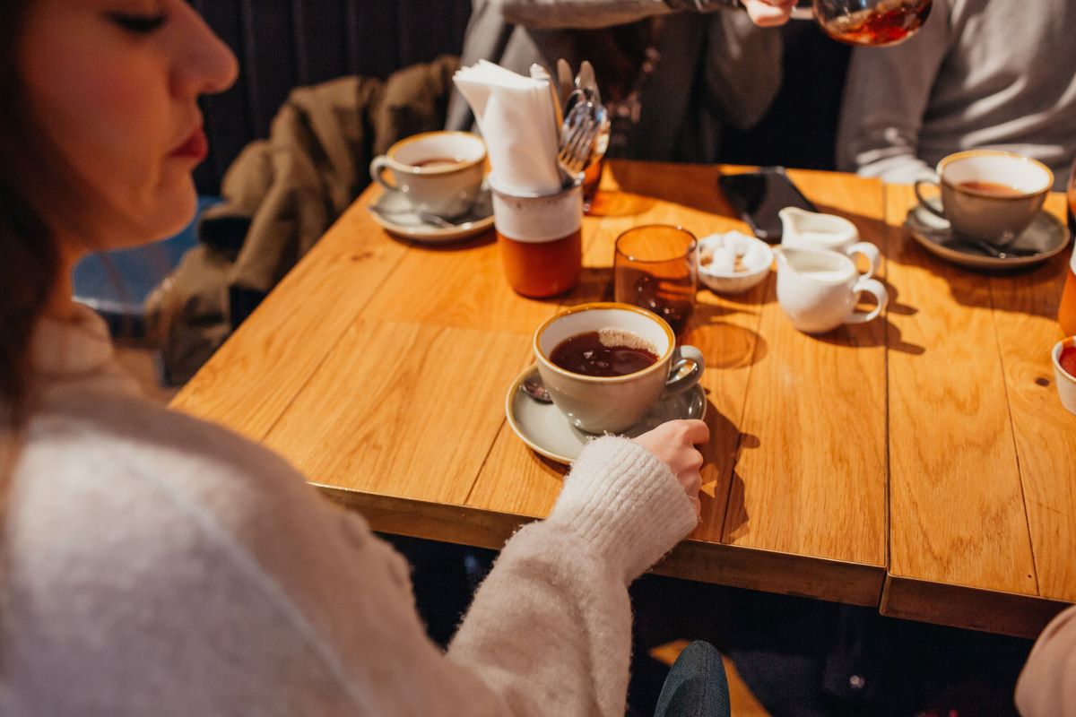 lady enjoying a hot cup of tea