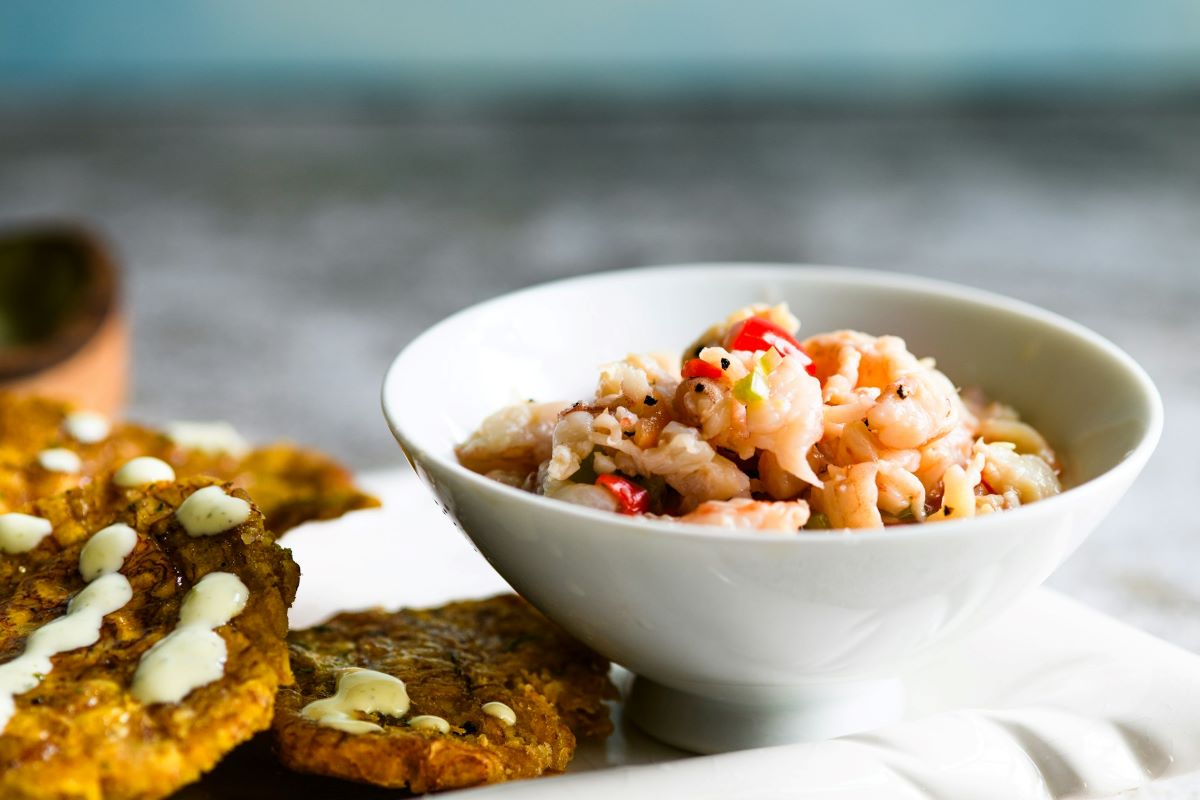 A plate of ceviche in a porcelain bowl. 