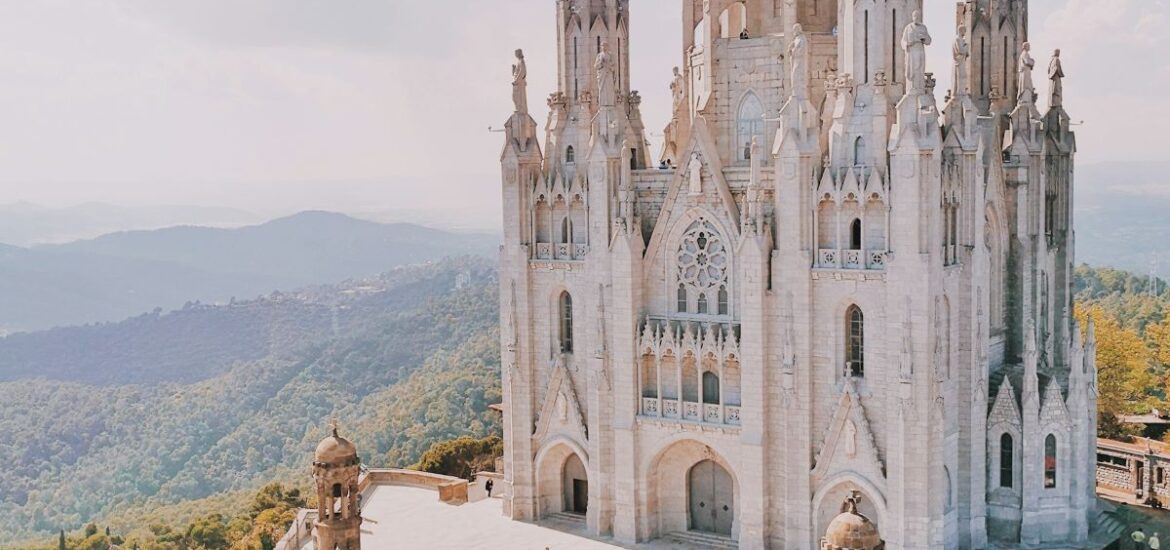 People walking around a church in Barcelona.