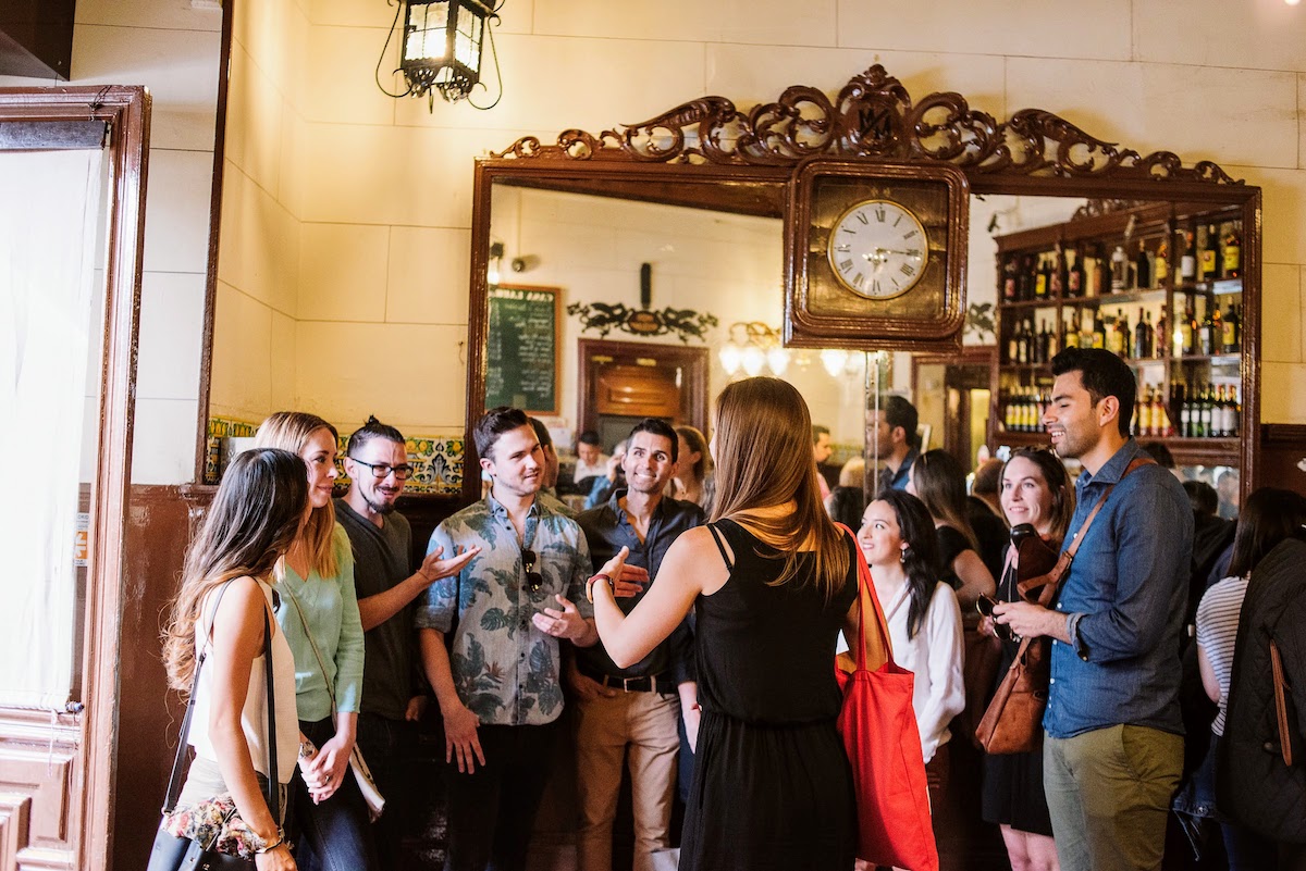 Tour group inside a historic tavern.