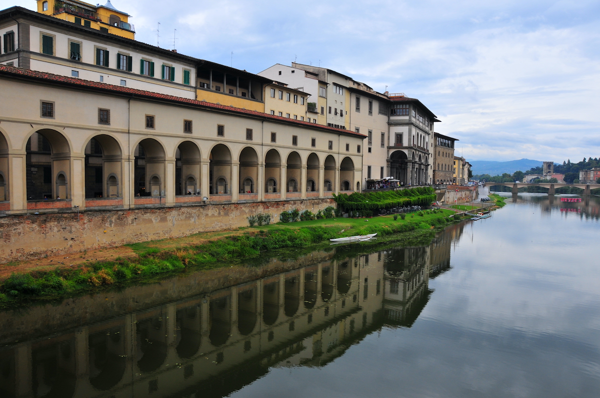 Building with multiple archways along a river