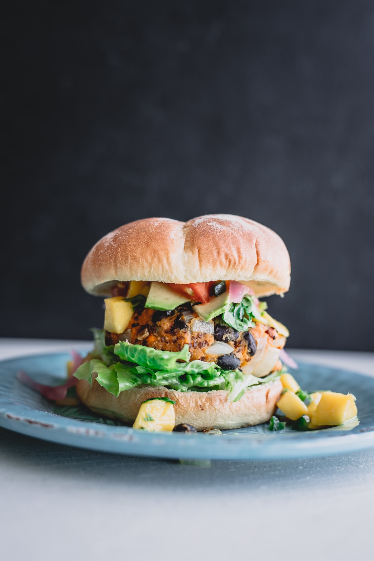 Vegetarian hamburger with avocado, lettuce, and black beans