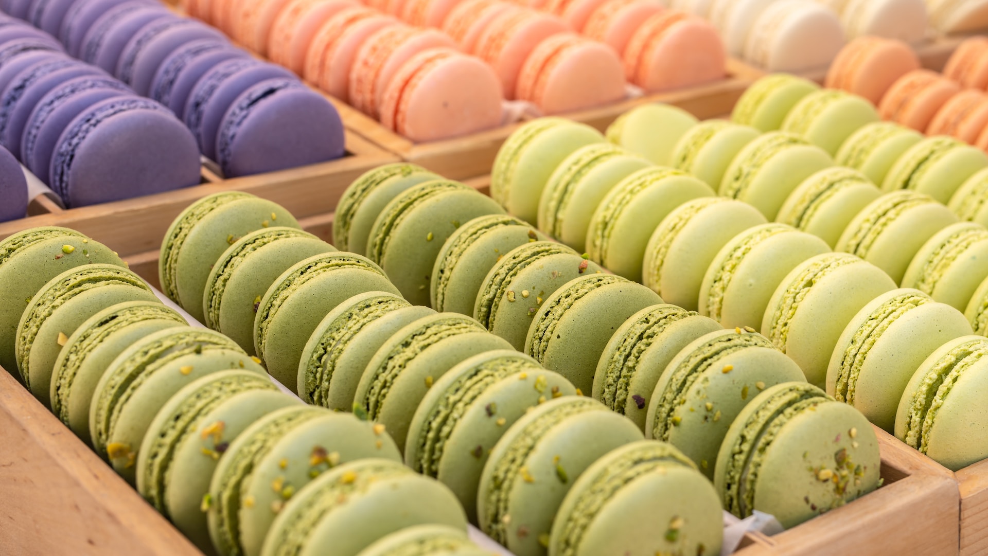 A colorful display of pastel colored macarons