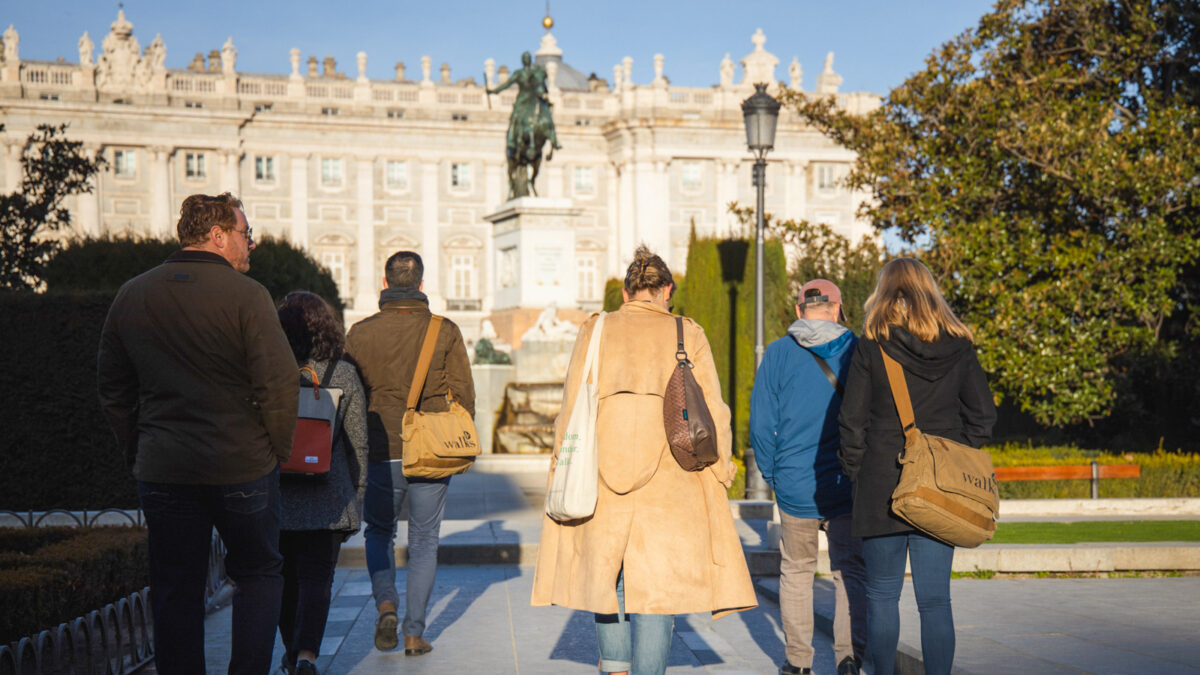 A group of people walking around Madrid in winter. 