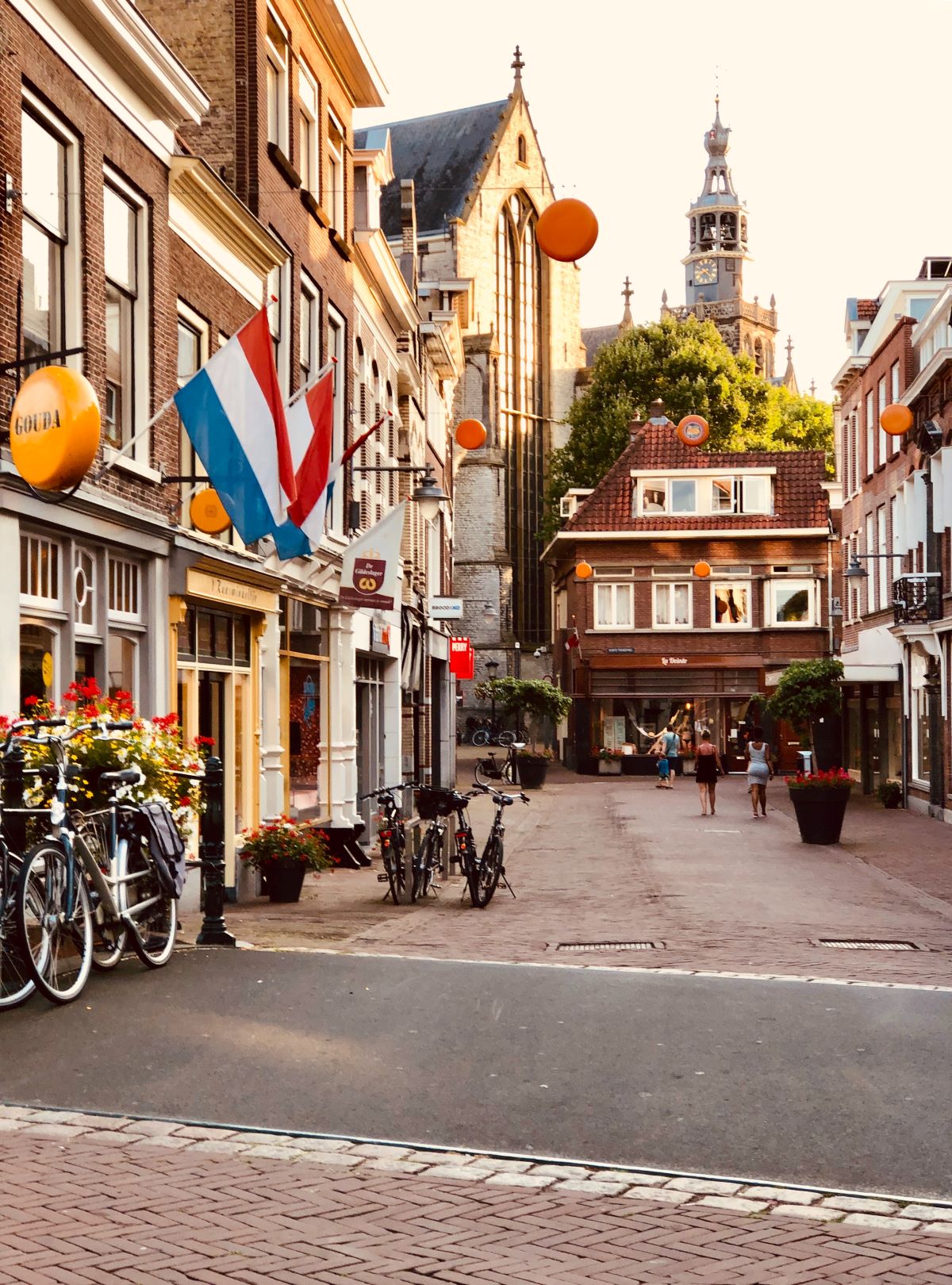 A charming street filled with people and bicycles